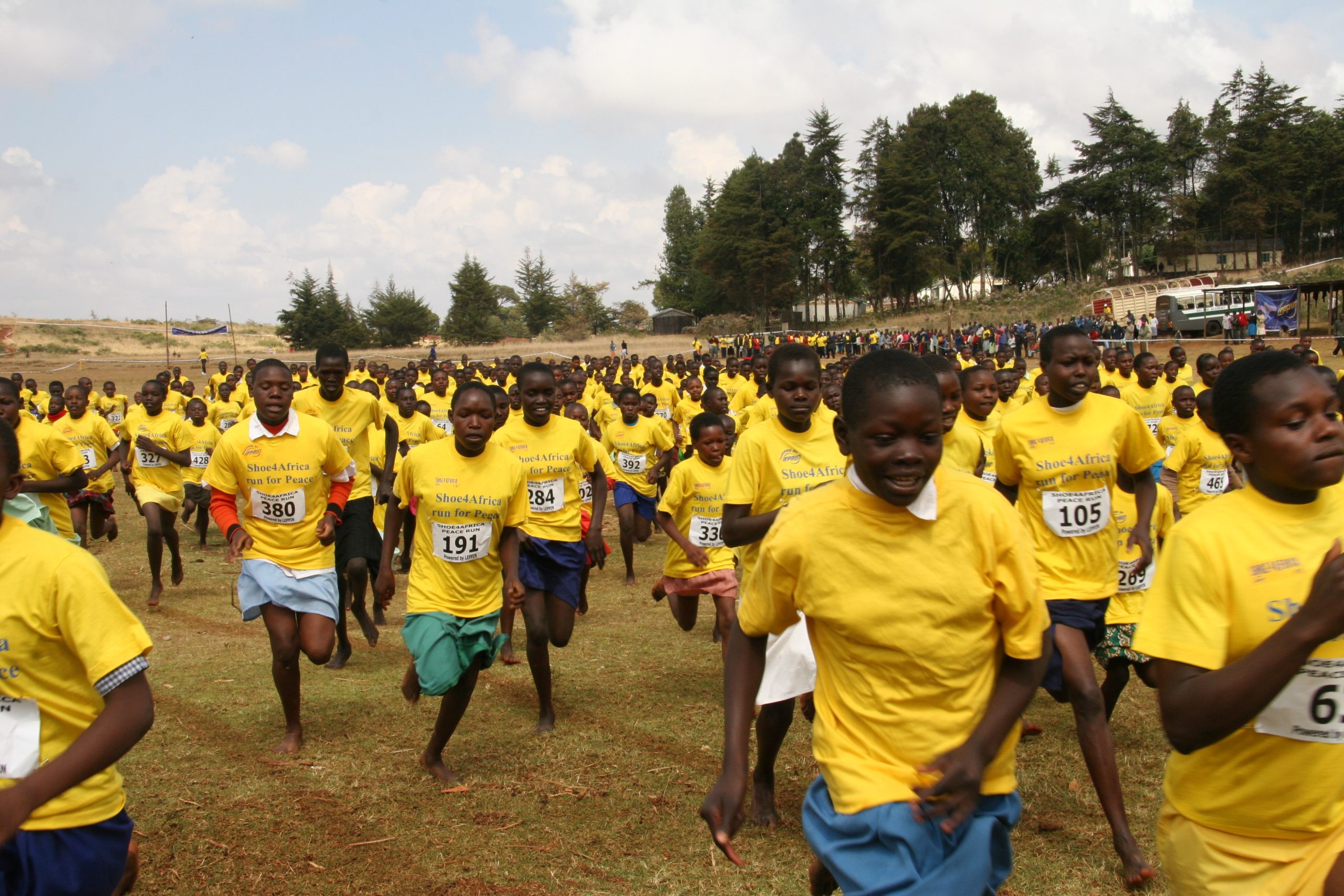 Kenyan school girls run for peace at a Shoe4Africa event.
